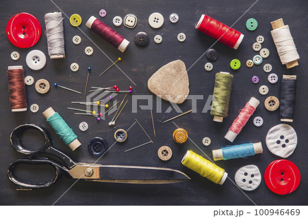 Tailor's set. Scissors, needles, threads, buttons, thimble and chalk 100946469