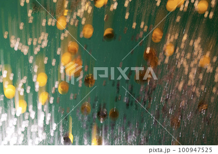 Defocused green and golden holiday bokeh. Abstract christmas background 100947525