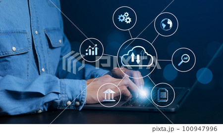 Businessman using computer cloud computing network. Cloud technology, data transfer and online data storage for business network, data backup of business intelligence on internet data storage network. 100947996