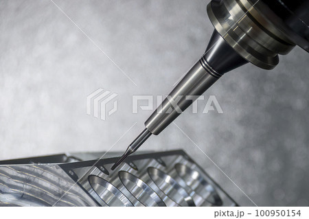 Close up scene the 5-axis machining center cutting the V8 engine cylinder block with solid ball end mill tool. Close up scene the 5-axis machining center cutting the V8 engine cylinder block with solid ball end mill tool. 100950154