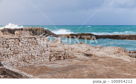 Coastal landscape with splashing waves at stormy Mediterranean Sea Coastal landscape with splashing waves at stormy Mediterranean Sea 100954212