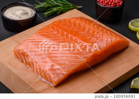 Fresh tasty raw red fish fillet with spices and herbs 100956091