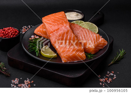 Fresh tasty raw red fish fillet with spices and herbs 100956105
