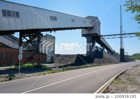 Coal mining and storage. Close-up of coal industry objects 100956195