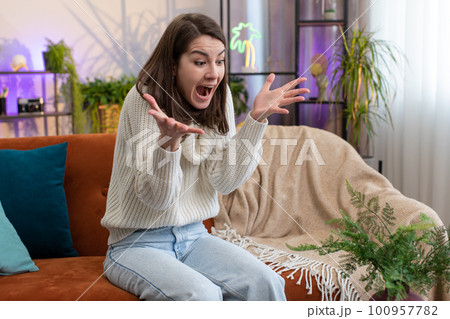 Stressed woman screams from stress tension problems panic horror hopelessness fear surprise shock Stressed woman screams from stress tension problems panic horror hopelessness fear surprise shock 100957782