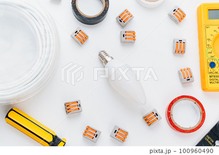 working tools for an electrician on a white background. 100960490