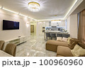 Studio apartment featuring classic kitchen with island, and wall-mounted TV set 100960960