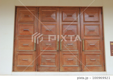 the Old wooden door from a barn isolated the Old wooden door from a barn isolated 100969921
