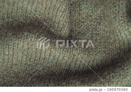 Handmade knitting texture with macro woven threads. 100970360