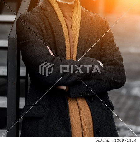 elegant handsome man in coat 100971124