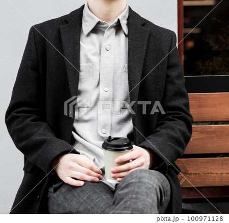 Elegant man with coffee cup 100971128