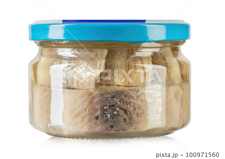 Sliced salted and pickled herring fish in jar with blue lid isolated on white background. Sliced salted and pickled herring fish in jar with blue lid isolated on white background. 100971560