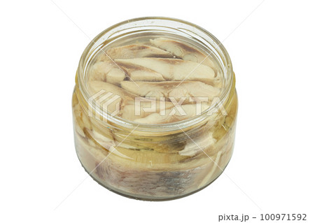 Sliced salted and pickled herring fish in jar isolated on white background. 100971592