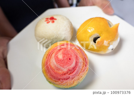 Vibrant Mooncakes on a White Platter 100973376