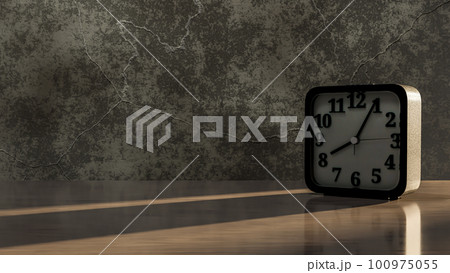 Alarm clock on desk and dark tone. Light shines through the window from the side. Can be used for background in education or business. Alarm clock on desk and dark tone. Light shines through the window from the side. Can be used for background in education or business. 100975055