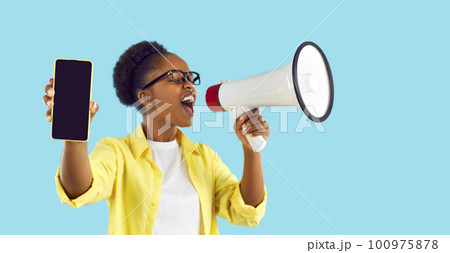 Woman advertising sale, showing phone with mockup screen and yelling in megaphone Woman advertising sale, showing phone with mockup screen and yelling in megaphone 100975878