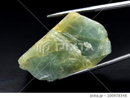 Natural gemstone green beryl on black background Natural gemstone green beryl on black background 100978348