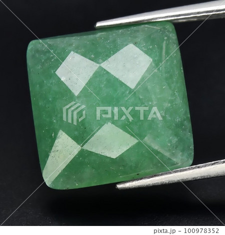 Natural gemstone green aventurine on black background 100978352