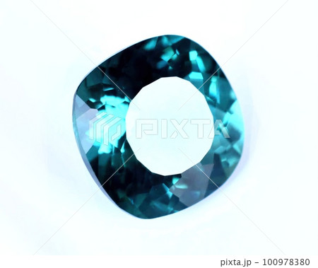 Natural gemstone blue tourmaline indicolite on gray background Natural gemstone blue tourmaline indicolite on gray background 100978380