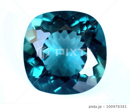 Natural gemstone blue tourmaline indicolite on gray background Natural gemstone blue tourmaline indicolite on gray background 100978381