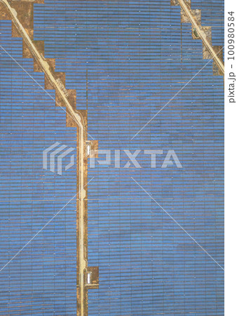 Solar cell panels at solar farm, drone view. Green energy concept. Solar cell panels at solar farm, drone view. Green energy concept. 100980584