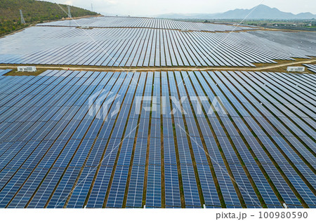 Solar cell panels at solar farm, drone view. Green energy concept. Solar cell panels at solar farm, drone view. Green energy concept. 100980590