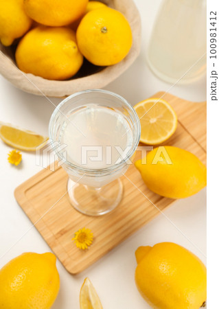 Concept of tasty drink, Limoncello, Italian lemon liqueur Concept of tasty drink, Limoncello, Italian lemon liqueur 100981412