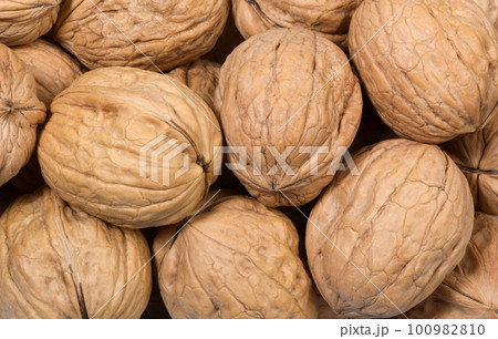 Whole walnuts as background Whole walnuts as background 100982810