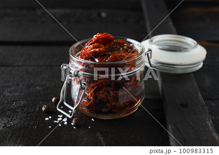 Concept of tasty food - sun-dried tomato 100983315