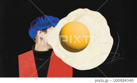 Young man hiding head behind fried egg symbolizing apathy. Feeling tired, stressful and uninterested. Contemporary art collage. 100984340