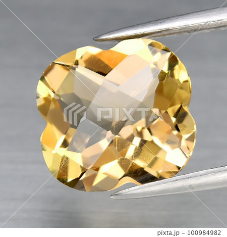 Natural gemstone orange topaz imperial on a gray background Natural gemstone orange topaz imperial on a gray background 100984982