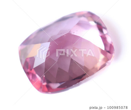 Natural gemstone pink sapphire on gray background 100985078