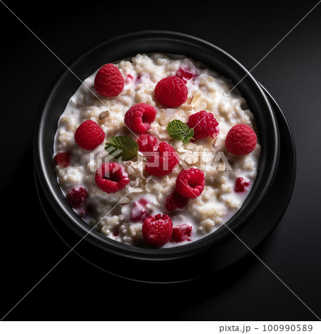 Appetizing delicious oatmeal with raspberries and cream isolated on black close-up, healthy breakfast dish, healthy food,  100990589