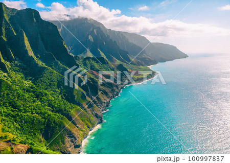 Hawaii Kauai lansdcape aerial view from the air helicopter flight. Amazing dramatic Na Pali coast of hawaiian island mountains, USA summer travel. 100997837