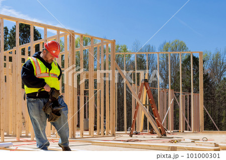 Worker are building of framing new wooden house Worker are building of framing new wooden house 101000301