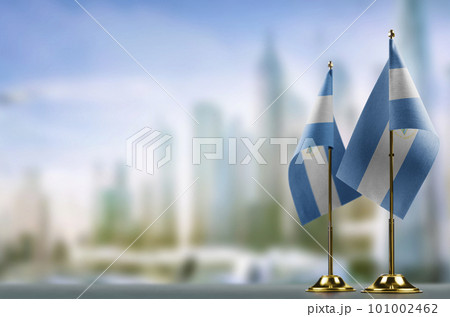Small flags of the Nicaragua on an abstract blurry background Small flags of the Nicaragua on an abstract blurry background 101002462