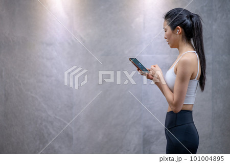 young woman health exercise cellphone young woman health exercise cellphone 101004895