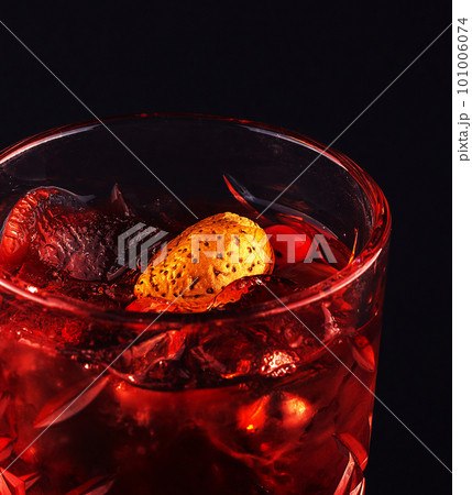 red drink cocktail in glass jar with cherry 101006074