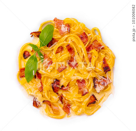Pasta with bacon and basil isolated on white Pasta with bacon and basil isolated on white 101006082