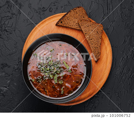 Traditional Ukrainian red soup borsch with slices of bread Traditional Ukrainian red soup borsch with slices of bread 101006752