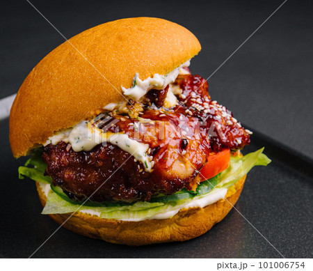 Craft burger is cooking on black tray Craft burger is cooking on black tray 101006754
