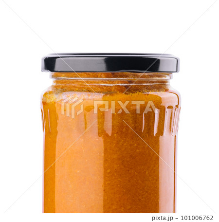The glass jar with squash caviar on white The glass jar with squash caviar on white 101006762