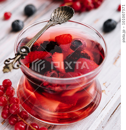 Jelly with fresh berries on wooden table close up Jelly with fresh berries on wooden table close up 101007371