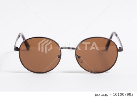Brown sunglasses isolated on white background close-up, fashionable trendy stylish accessory 101007992