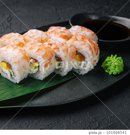 shrimp rolls on black stone plate 101008541