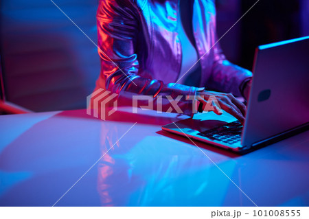 Closeup on female with laptop in office Closeup on female with laptop in office 101008555