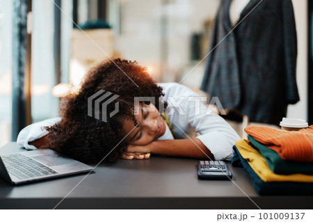 young teen african american fashion designer stylish burnout working at fashion Business studio. 101009137