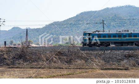 A train running in Chota Nagpur Plateau region in Jharkhand against mountain in the background. 101012838