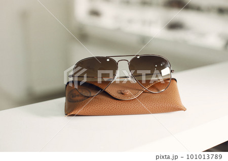 Glasses white background. Straight on view. Advertising photo of rounded metal eyewear. Fashion optical concept. 101013789