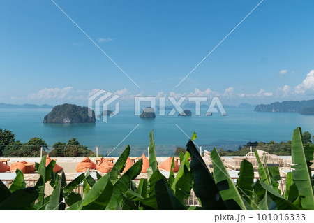 Khaothong view point, view of mountains in Krabi bay with mangrove forest in andaman sea with sunny sky from Khaothong Hill cafe. Travel destination in Krabi, Thailand. Khaothong view point, view of mountains in Krabi bay with mangrove forest in andaman sea with sunny sky from Khaothong Hill cafe. Travel destination in Krabi, Thailand. 101016333